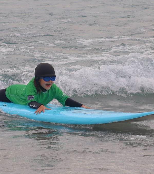 Boarding Millie surfing at The Wave in Bristol.